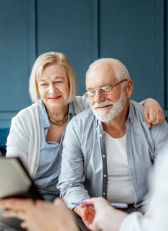 Older Couple signing contract